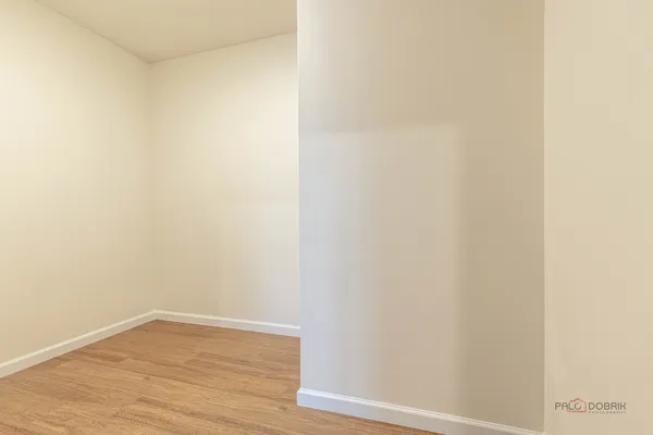 a view of a small space with wooden floor