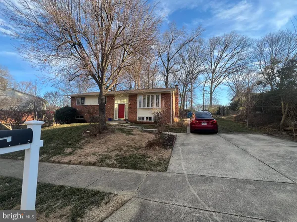 a view of a car parked in front of a house