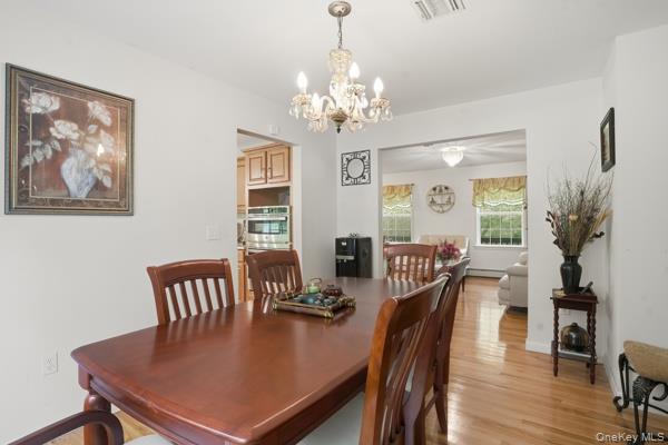 29 Hickory Hill Road Newburgh, NY 12550 - Photo 25 of 47 a view of a dining room with furniture window and wooden floor