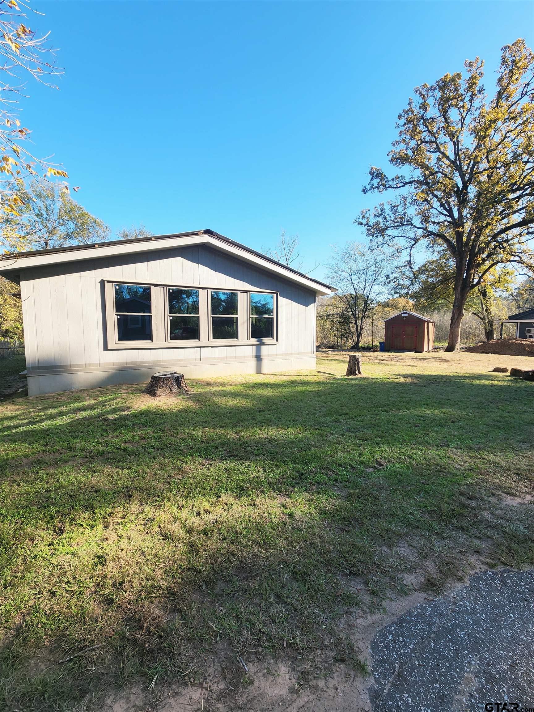 7679 Lindy Lane Frankston, TX 75763 - Photo 18 of 21 a front view of house with yard and green space