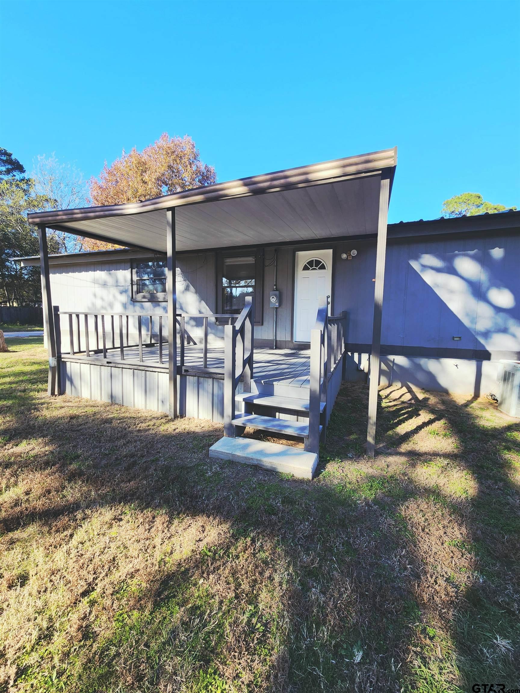 7679 Lindy Lane Frankston, TX 75763 - Photo 2 of 21 a view of a house with backyard porch and sitting area