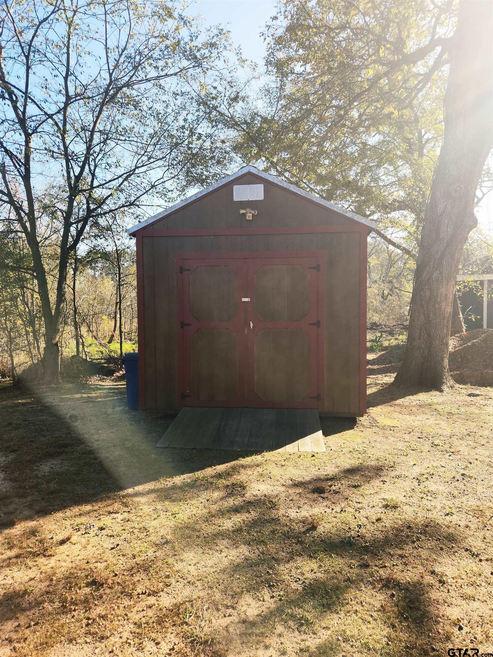 7679 Lindy Lane Frankston, TX 75763 - Photo 21 of 21 a backyard of a house with large trees