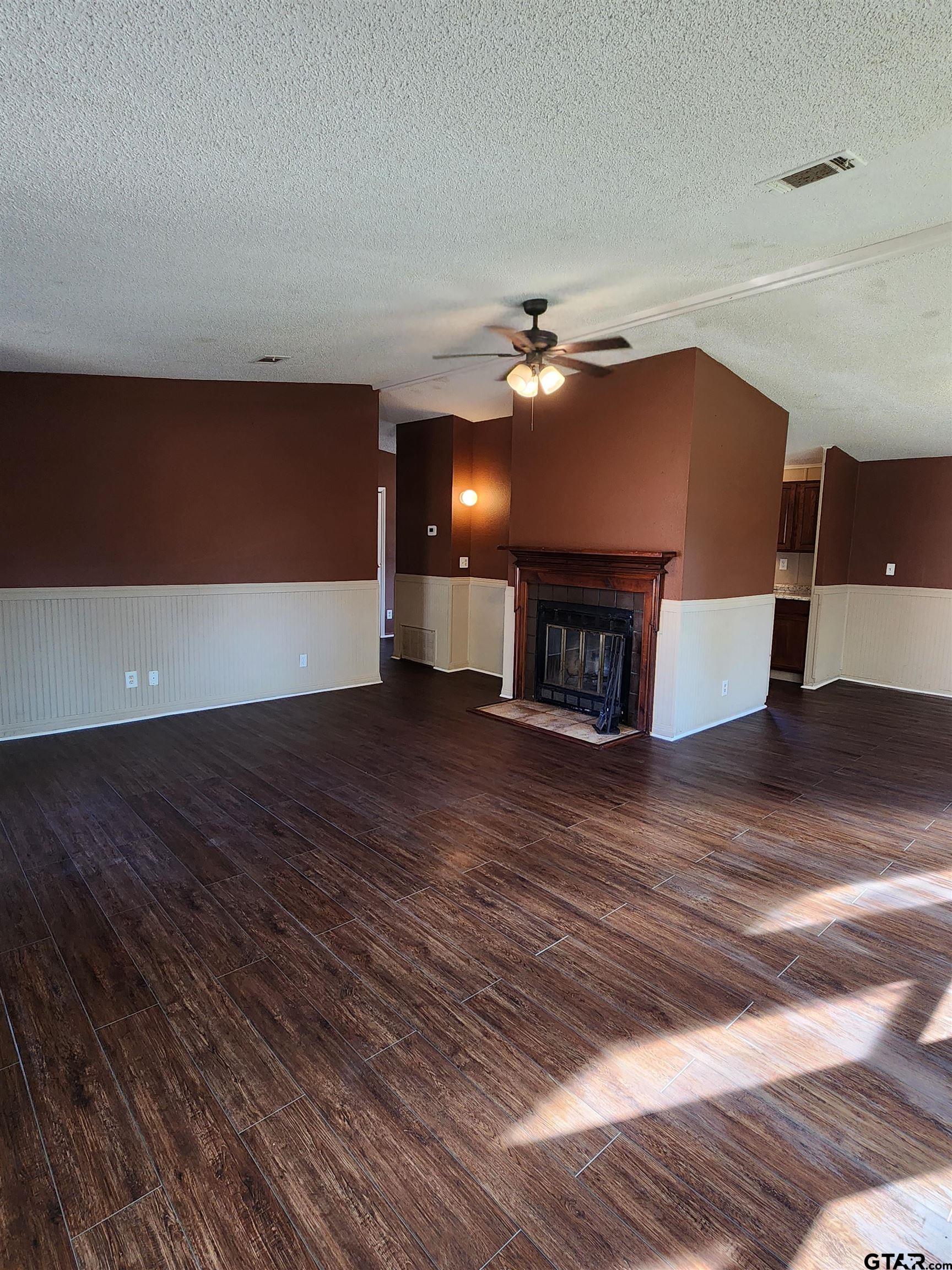 7679 Lindy Lane Frankston, TX 75763 - Photo 6 of 21 a view of a livingroom with a fireplace and window