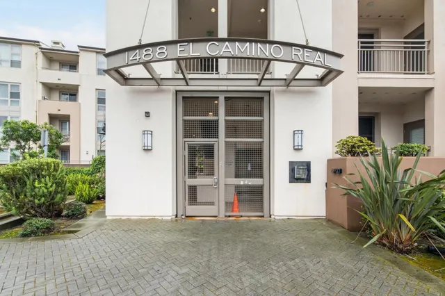 front view of a house with a potted plant