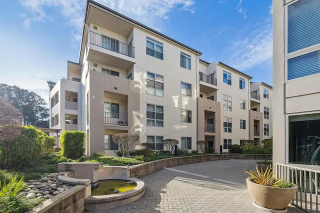 a front view of a building with outdoor seating
