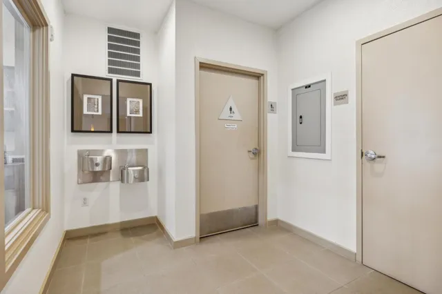 a view of a house with potted plants