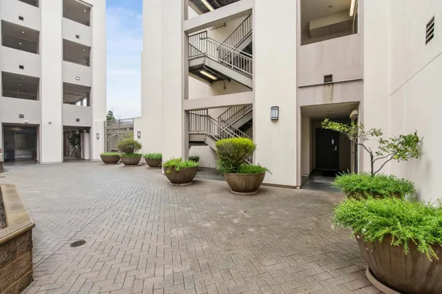 a view of a terrace with a garden and couches