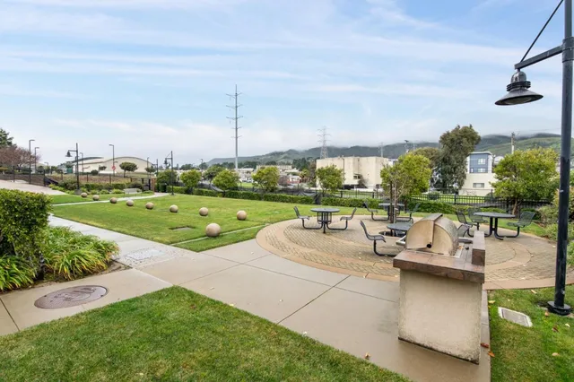 a view of a garden with sitting area