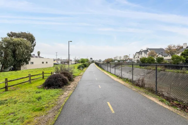a view of a swimming pool with a lawn chairs