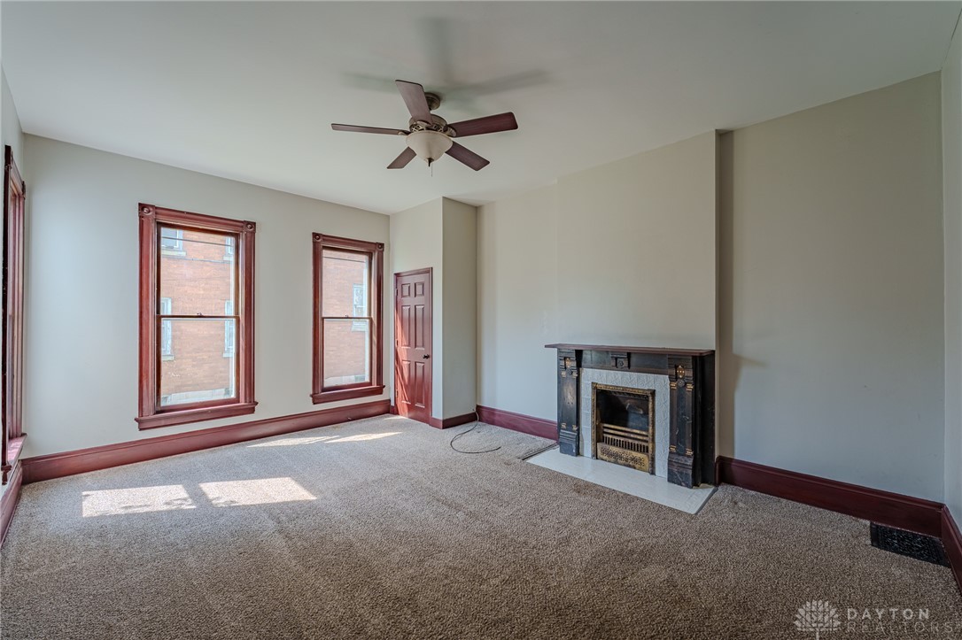 308 Yankee Road Middletown, OH 45044 - Photo 16 of 47 This inviting living space features warm natural light and a charming fireplace.