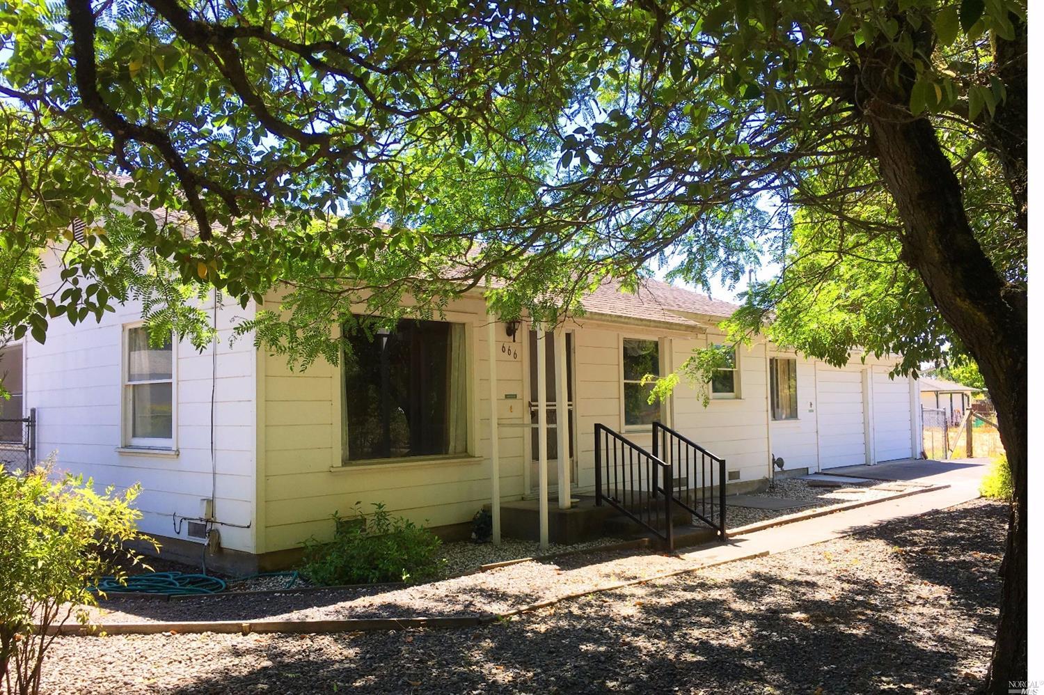 666 Hunter Lane Santa Rosa, CA 95407 - Photo 1 of 1 a front view of a house with a tree
