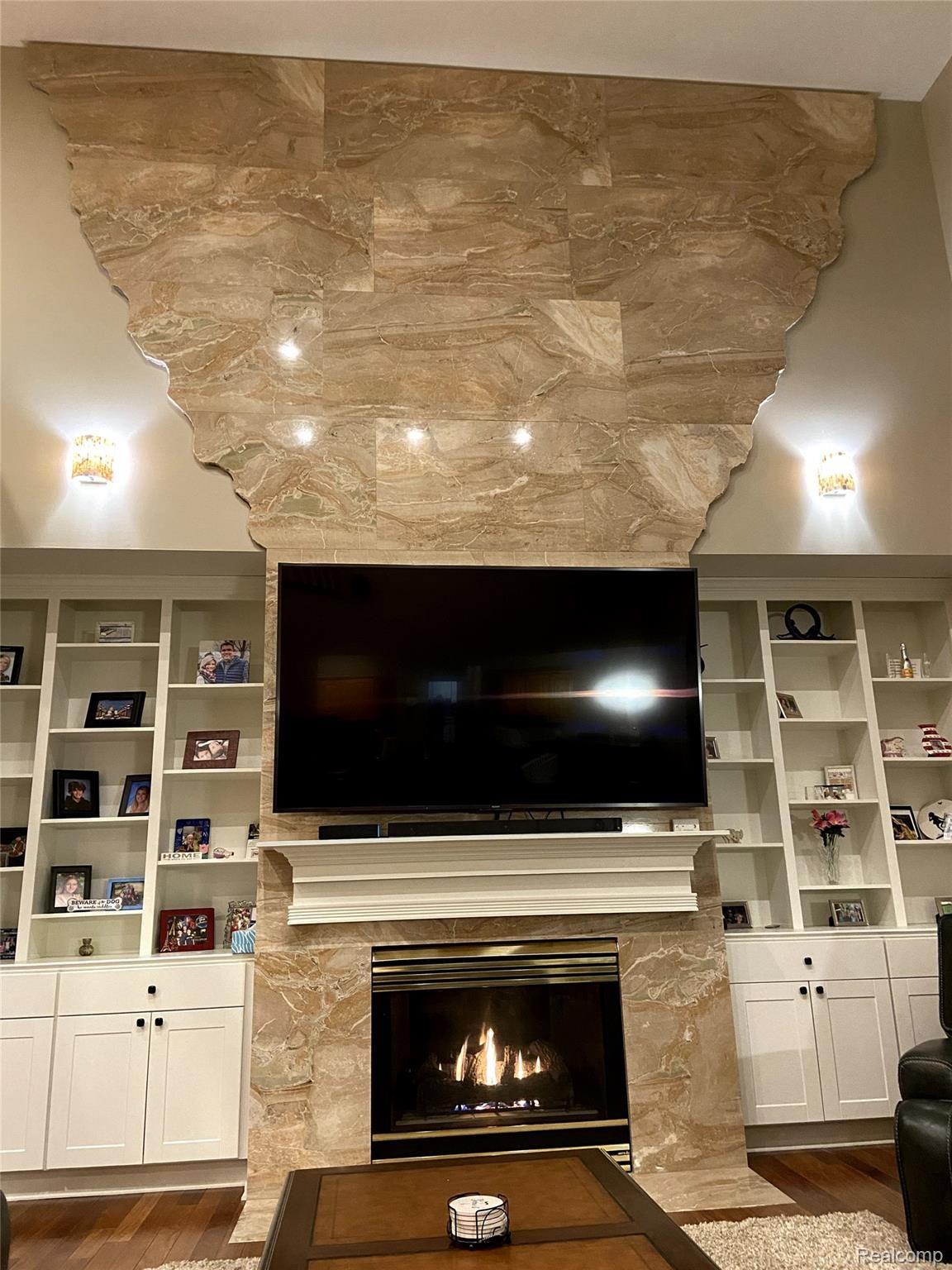 11636 Kings Colony Road Grand Blanc, MI 48439 - Photo 32 of 73 Floor to ceiling granite accent wall