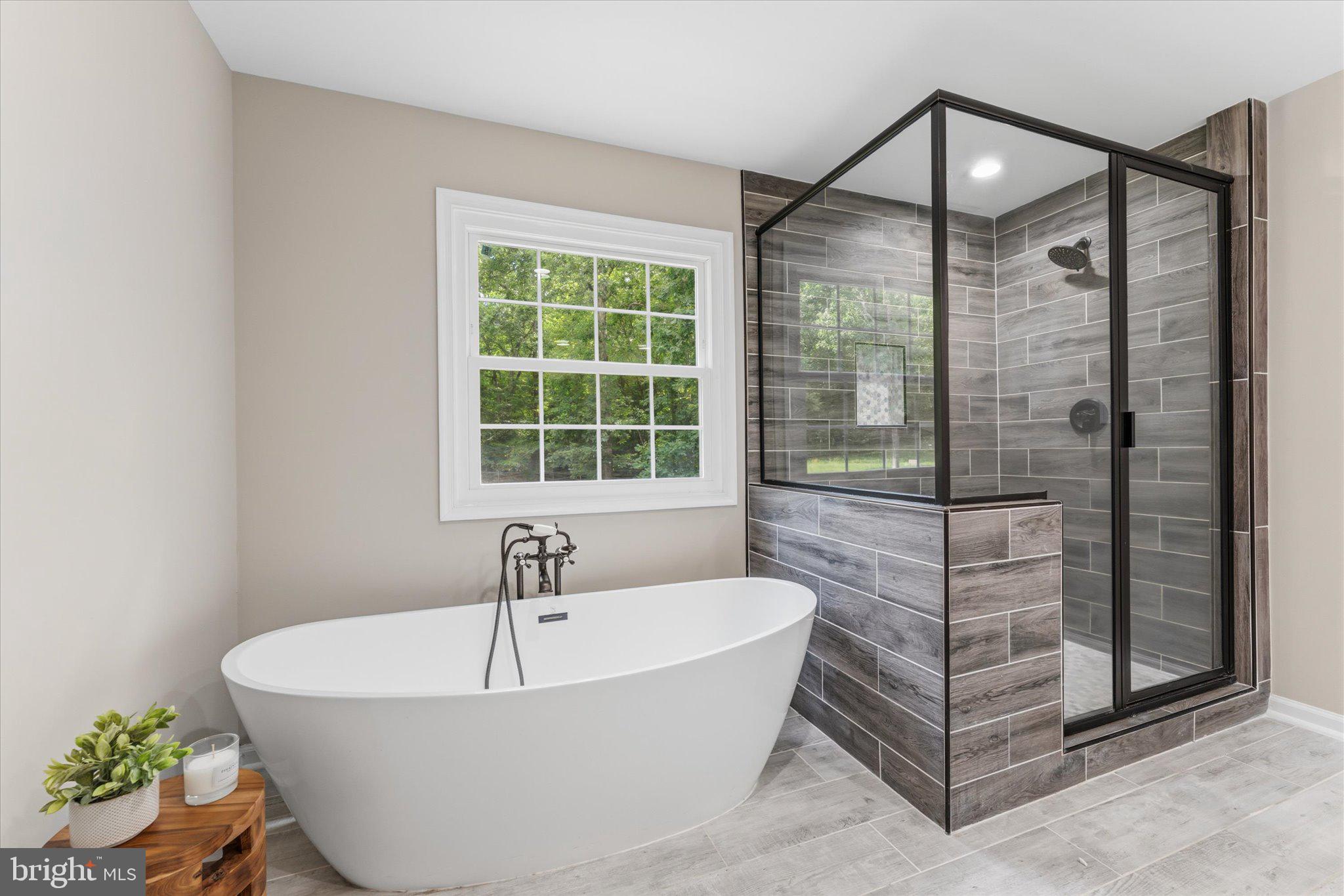8047 Counselor Road Manassas, VA 20112 - Photo 25 of 55 Spa-inspired primary bathroom with modern updates.