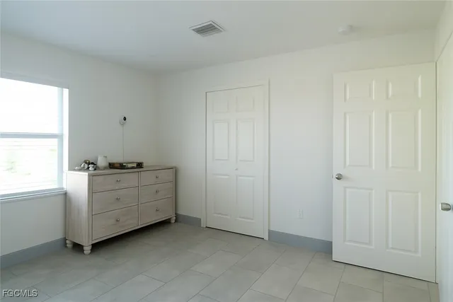 a room with cabinets and window