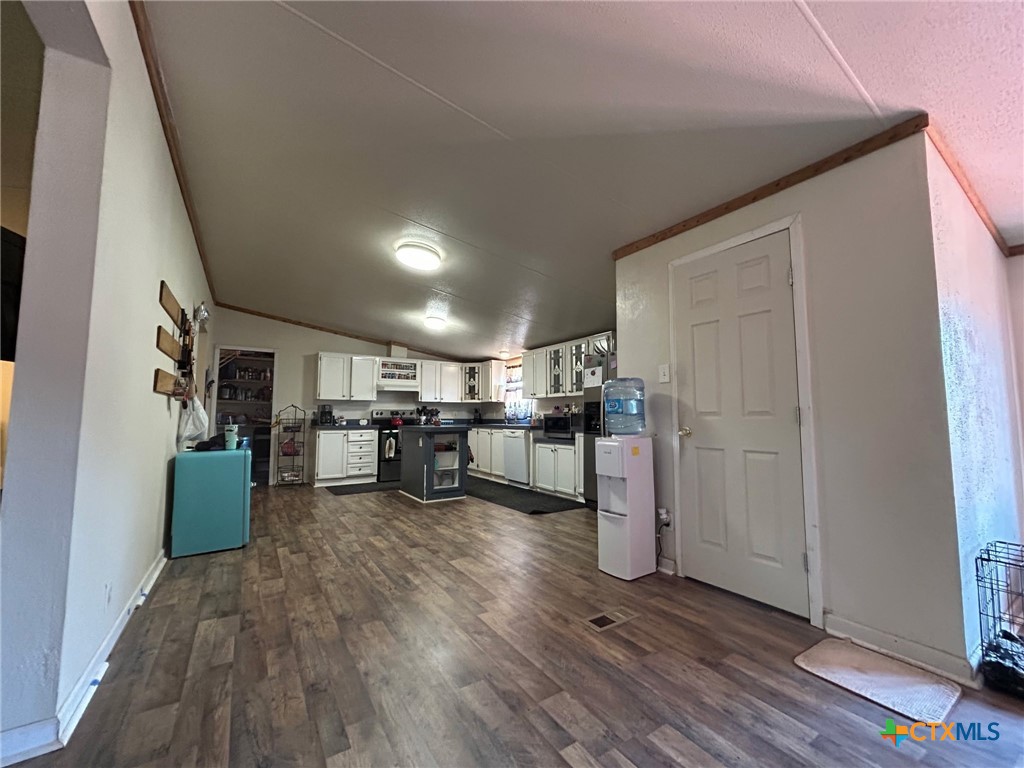 850 Blakely Road Gatesville, TX 76528 - Photo 19 of 32 a kitchen with stainless steel appliances a refrigerator and wooden floor