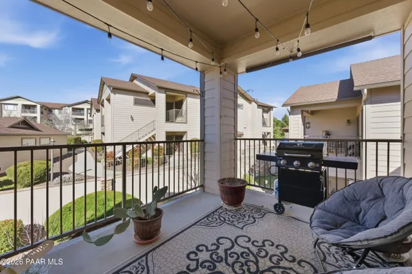 a livingroom with furniture and a potted plant