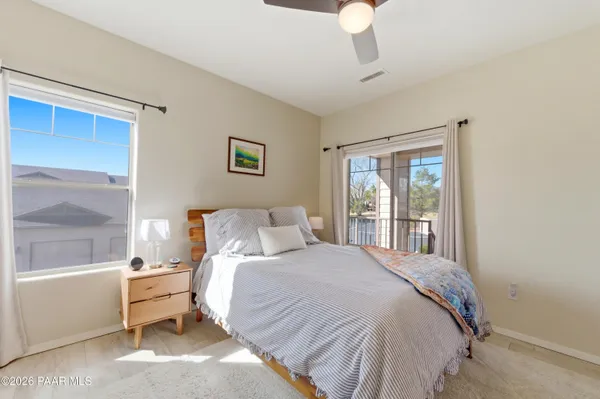 a bedroom with a large bed and a window