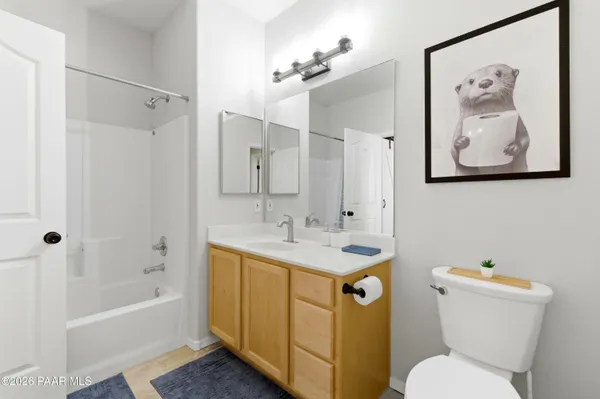 a bathroom with a sink a toilet and a bathtub