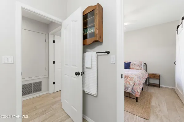 a bedroom with a bed and a walk in closet