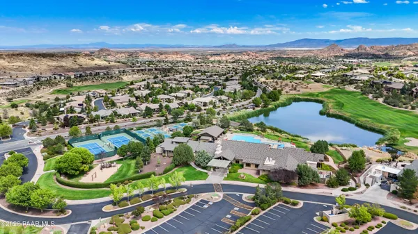 an aerial view of residential houses with outdoor space and street view