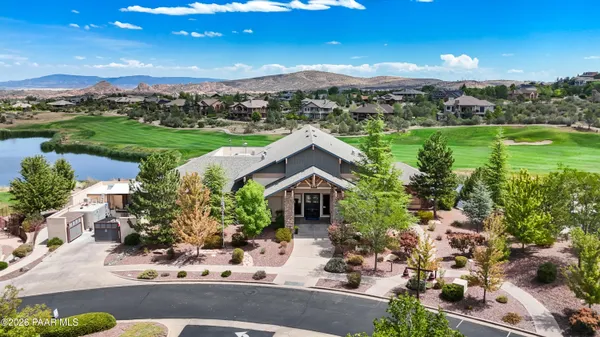 a view of a city street and trees