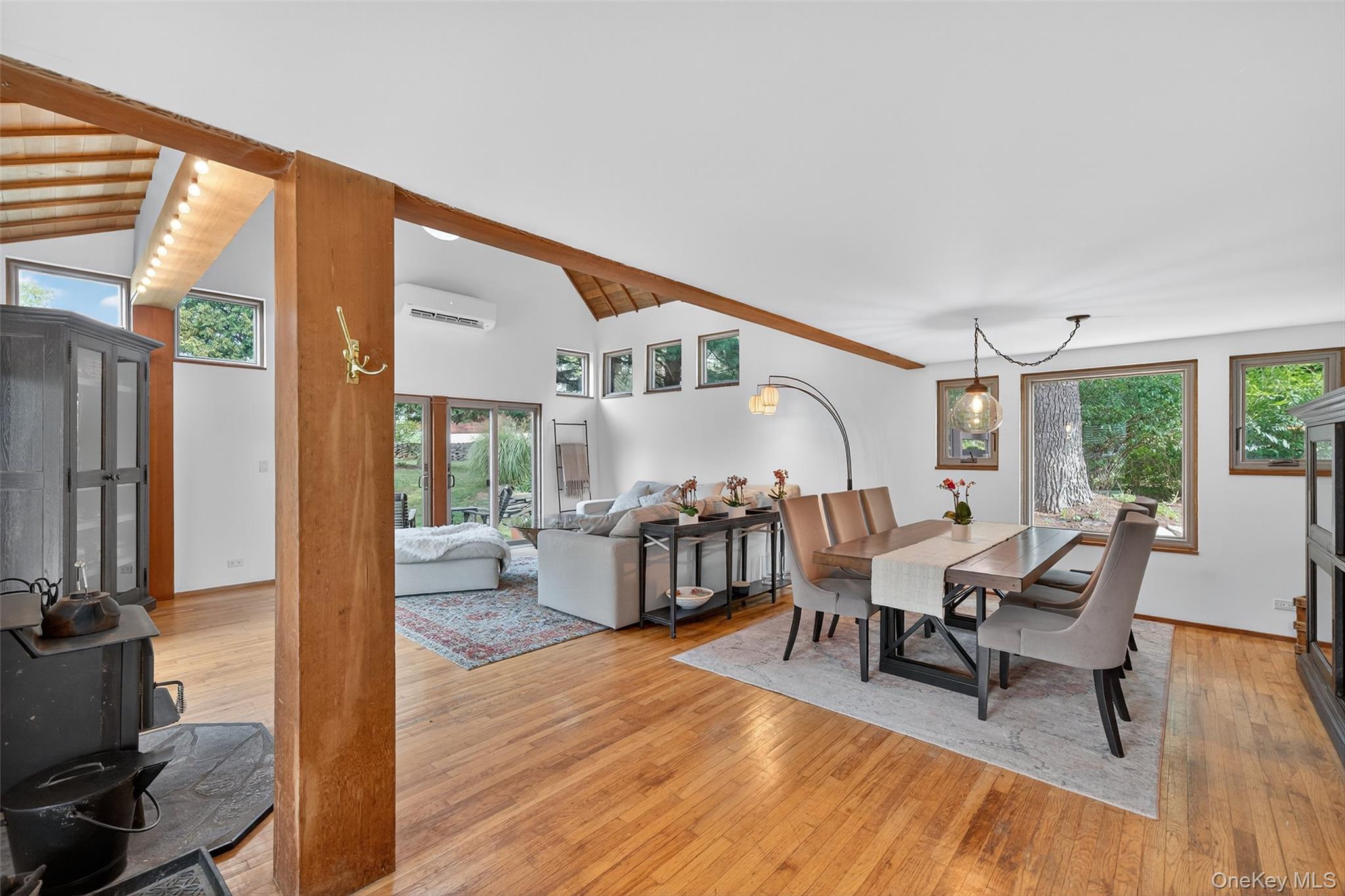 441 Scotchtown Collabar Road Middletown, NY 10941 - Photo 20 of 48 Dining space with light wood-style flooring, high vaulted ceiling, an AC wall unit, and beamed ceiling