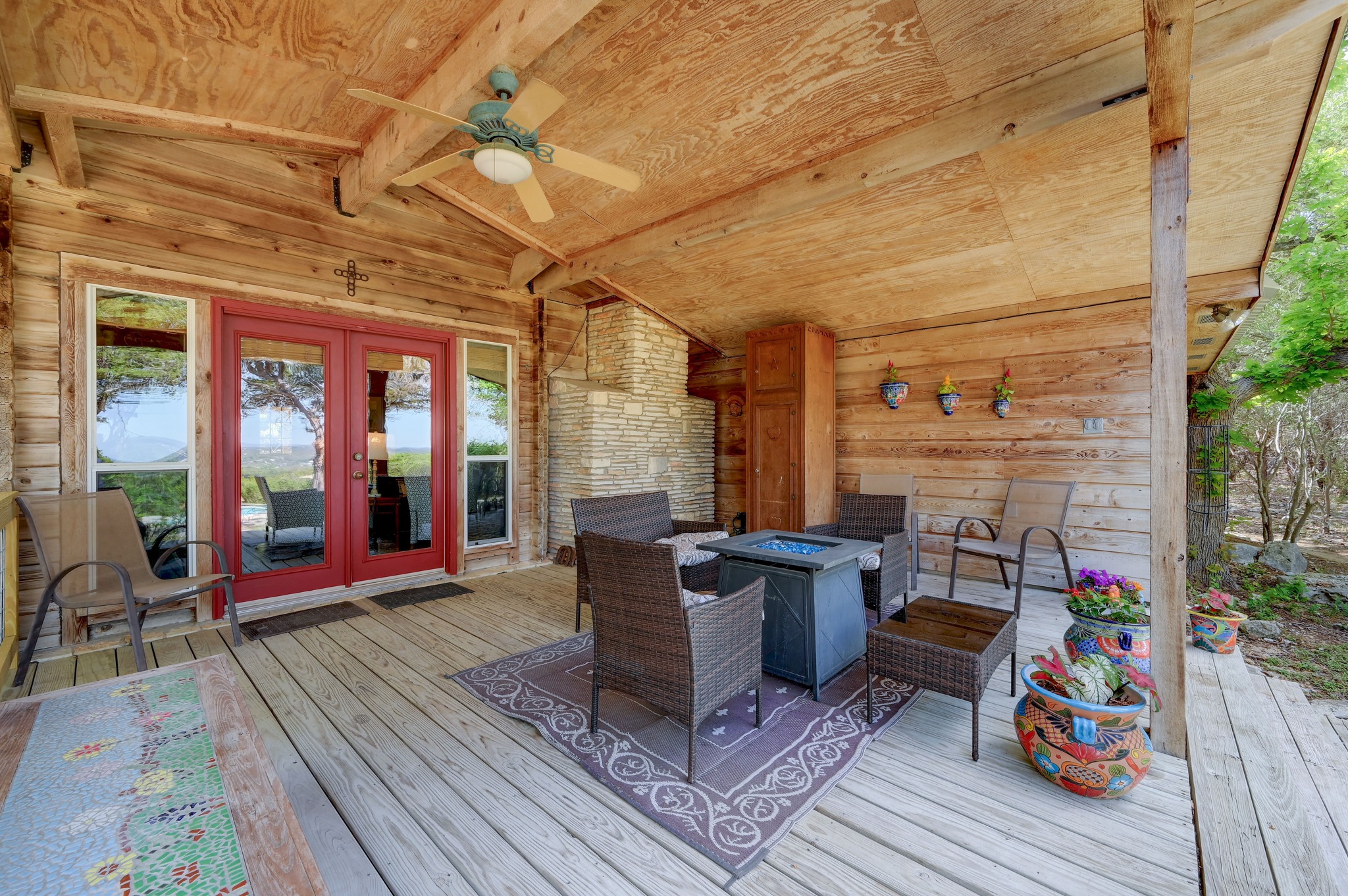 900 Box Canyon Road Wimberley, TX 78676 - Photo 33 of 40 This large covered back porch is the perfect spot to watch the sun setting year round.