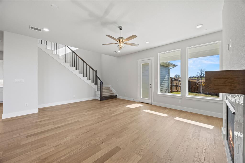505 Callum Parkway Celina, TX 75009 - Photo 15 of 34 wooden floor in an empty room with a window