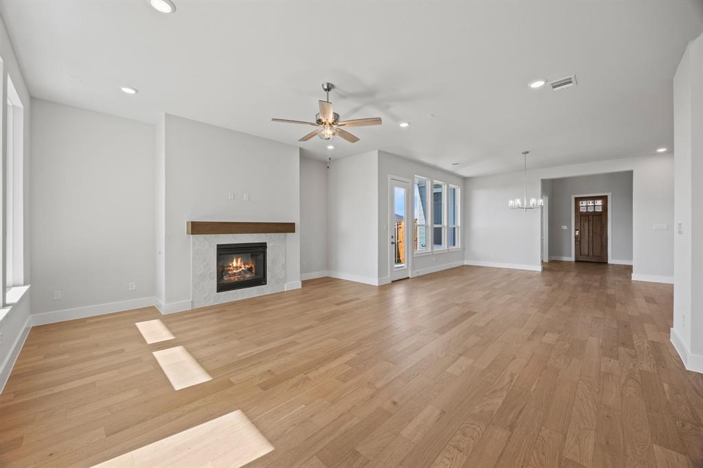 505 Callum Parkway Celina, TX 75009 - Photo 16 of 34 a view of an empty room with a fireplace
