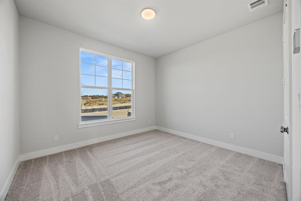 505 Callum Parkway Celina, TX 75009 - Photo 19 of 34 a view of an empty room with a window