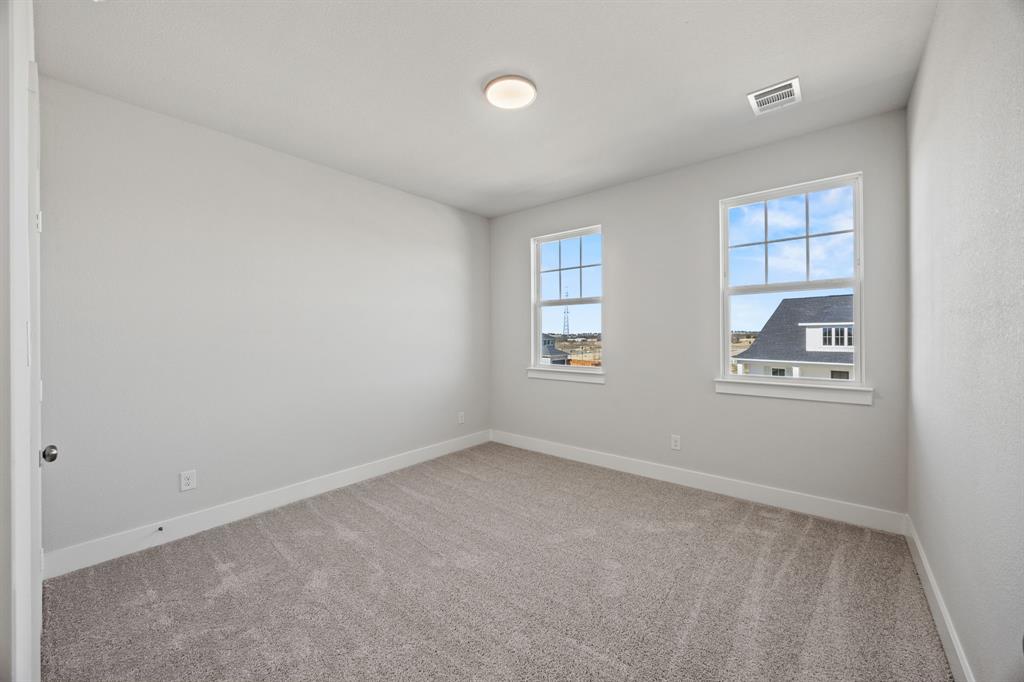 505 Callum Parkway Celina, TX 75009 - Photo 23 of 34 an empty room with windows