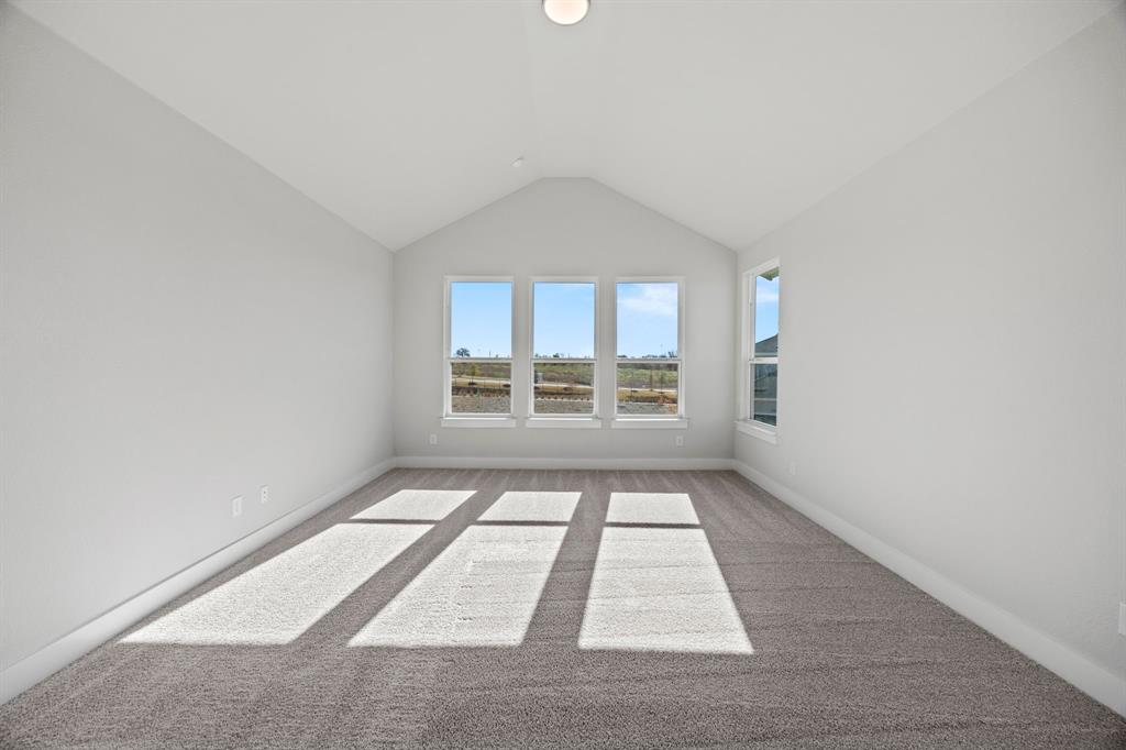 505 Callum Parkway Celina, TX 75009 - Photo 27 of 34 an empty room with windows