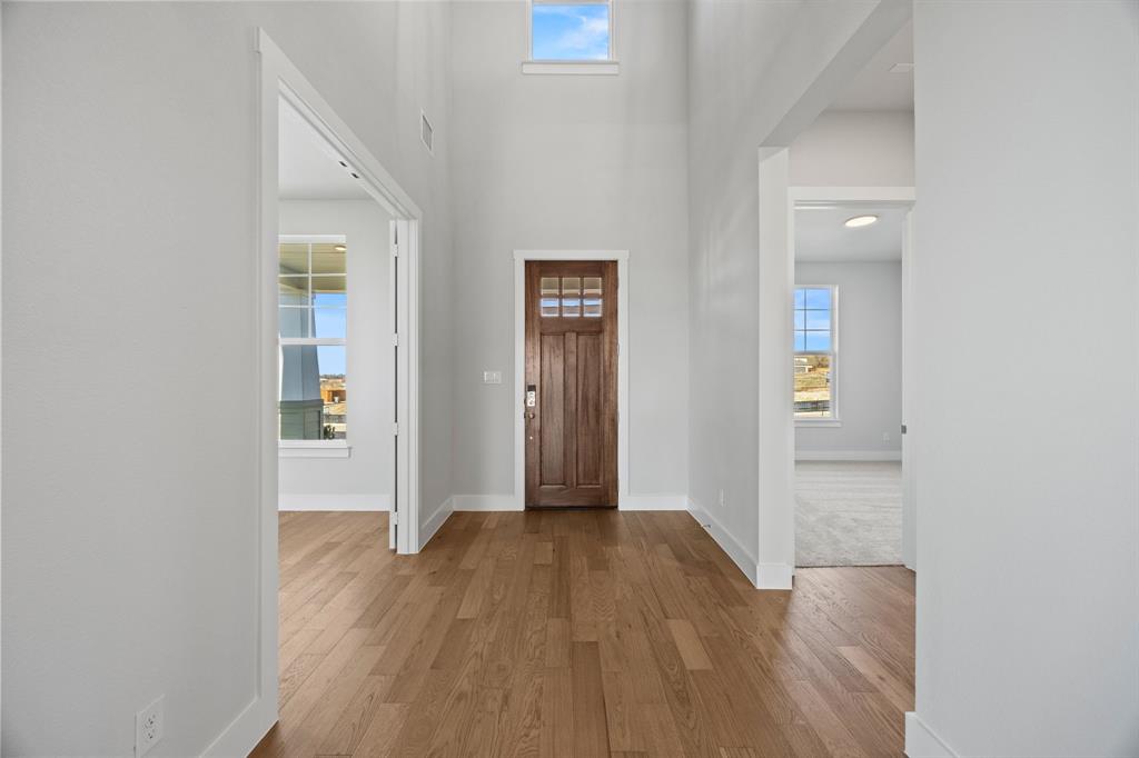 505 Callum Parkway Celina, TX 75009 - Photo 3 of 34 a view of hallway with wooden floor