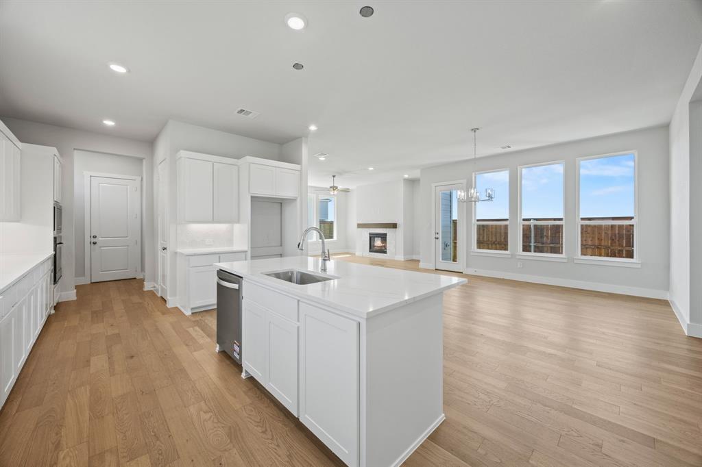 505 Callum Parkway Celina, TX 75009 - Photo 10 of 34 a large white kitchen with a large window