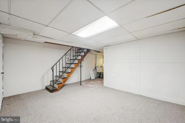 a view of an empty room with stairs