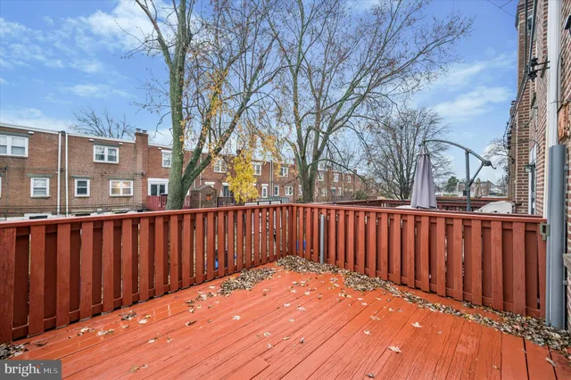 a view of wooden fence and trees