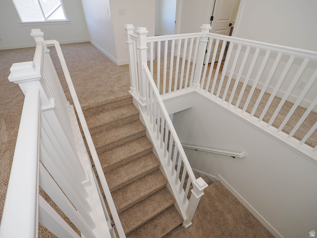 3938 North Wood Road Eagle Mountain, UT 84005 - Photo 35 of 55 Staircase featuring carpet flooring and baseboards