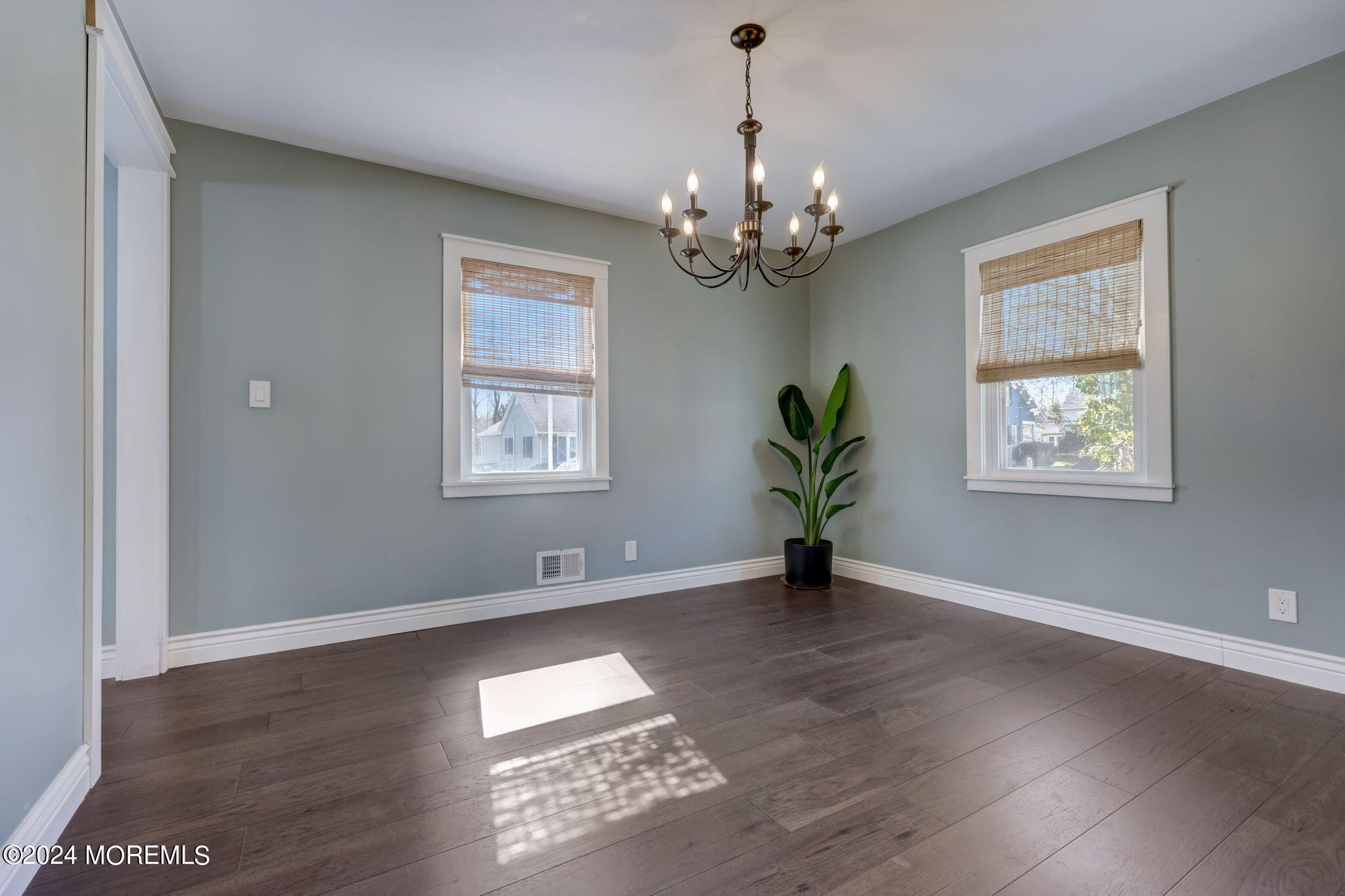 154 Ridge Avenue Belford, NJ 07718 - Photo 11 of 28 a view of an empty room with wooden floor and a window