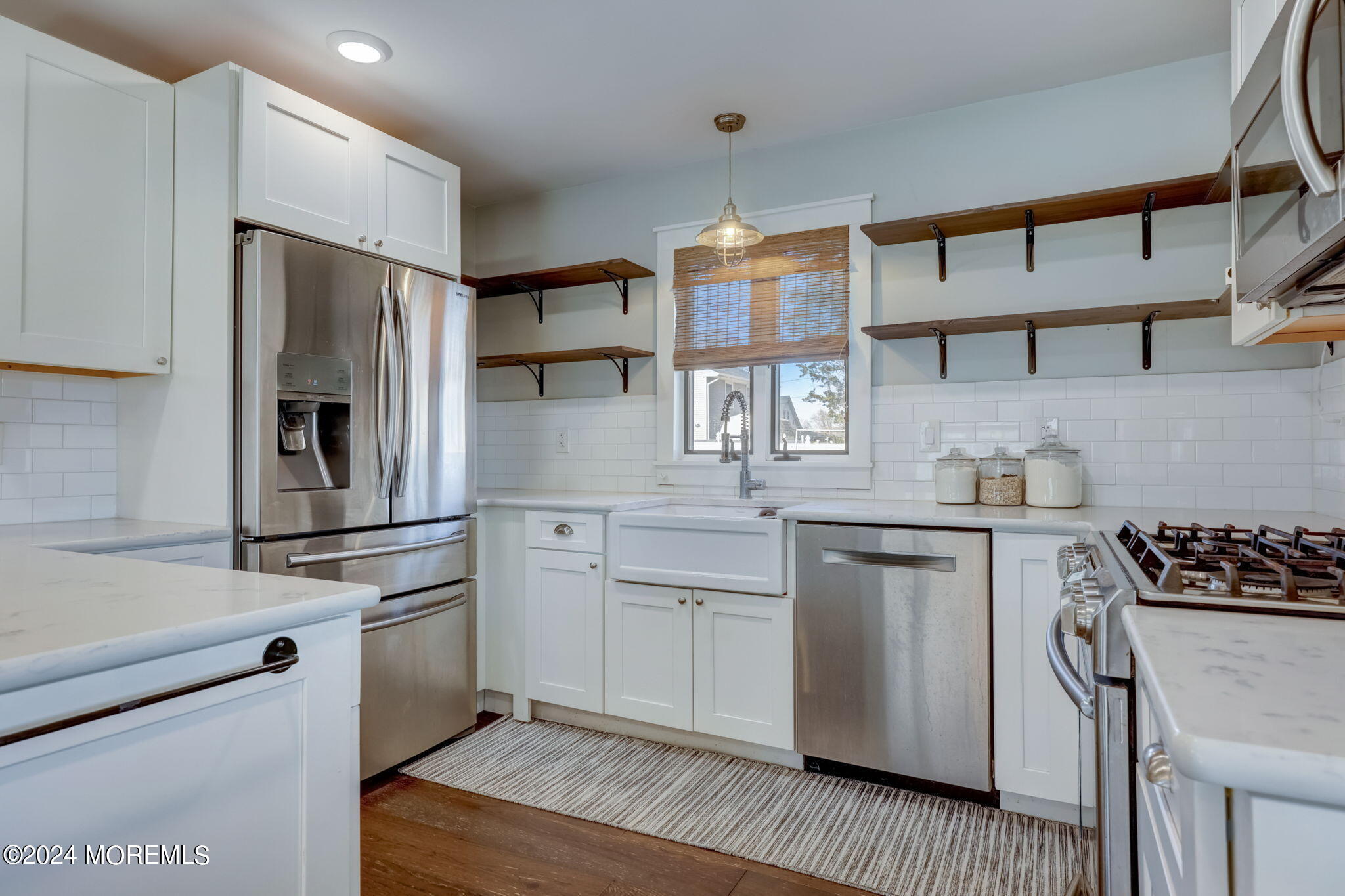 154 Ridge Avenue Belford, NJ 07718 - Photo 13 of 28 a kitchen with stainless steel appliances a refrigerator sink and stove