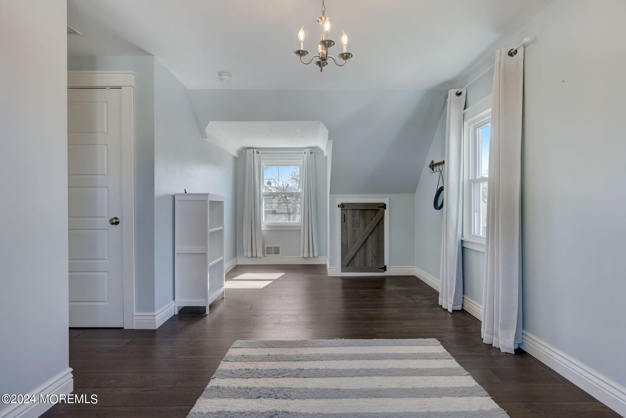 154 Ridge Avenue Belford, NJ 07718 - Photo 21 of 28 a view of an entryway with wooden floor and a chandelier