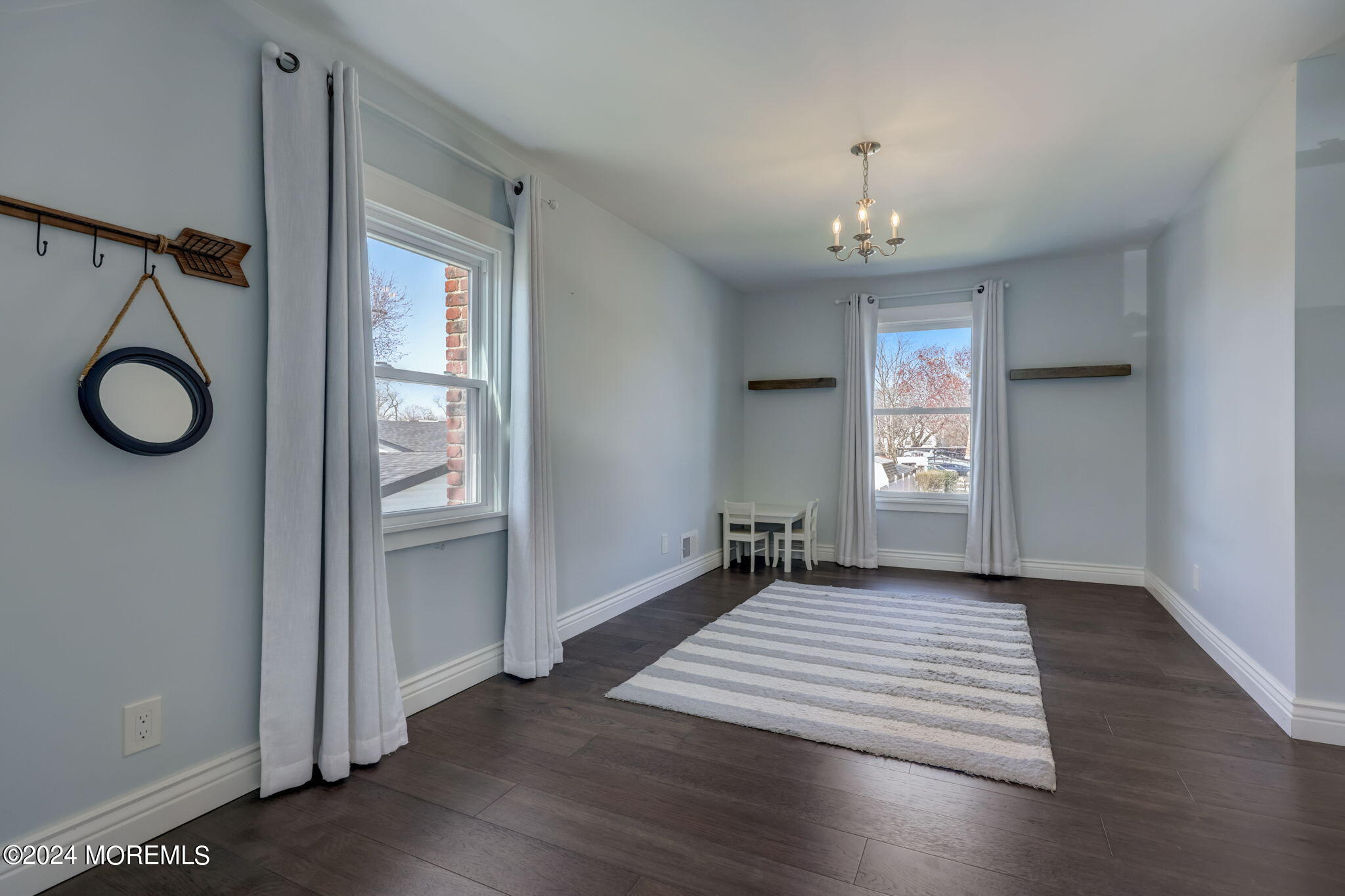 154 Ridge Avenue Belford, NJ 07718 - Photo 22 of 28 an empty room with wooden floor cabinet and windows
