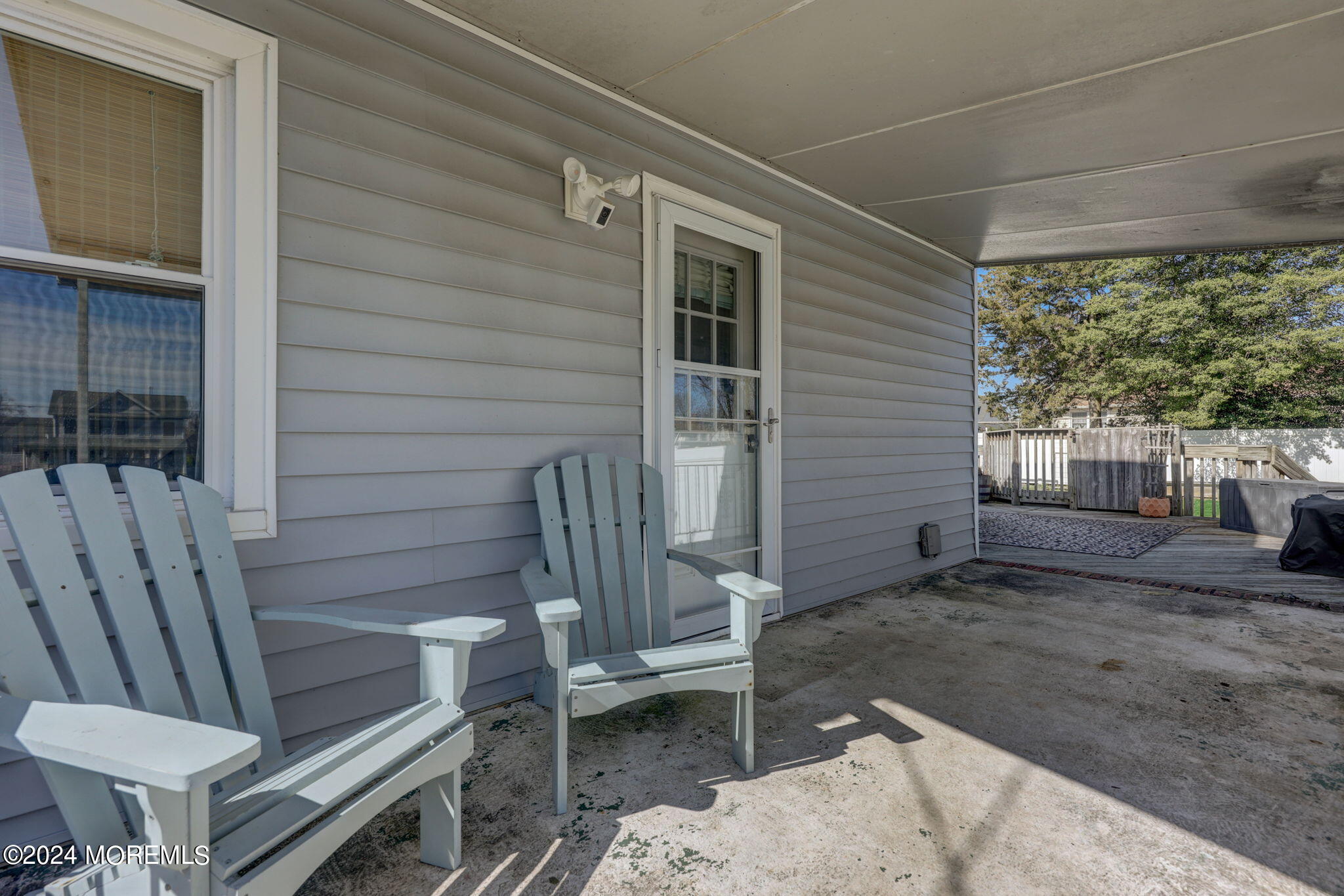 154 Ridge Avenue Belford, NJ 07718 - Photo 24 of 28 a view of a backyard with chairs and a swing