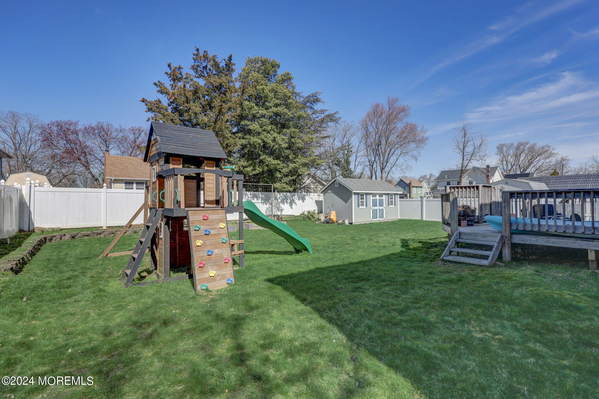 154 Ridge Avenue Belford, NJ 07718 - Photo 26 of 28 a view of a house with a yard porch and sitting area