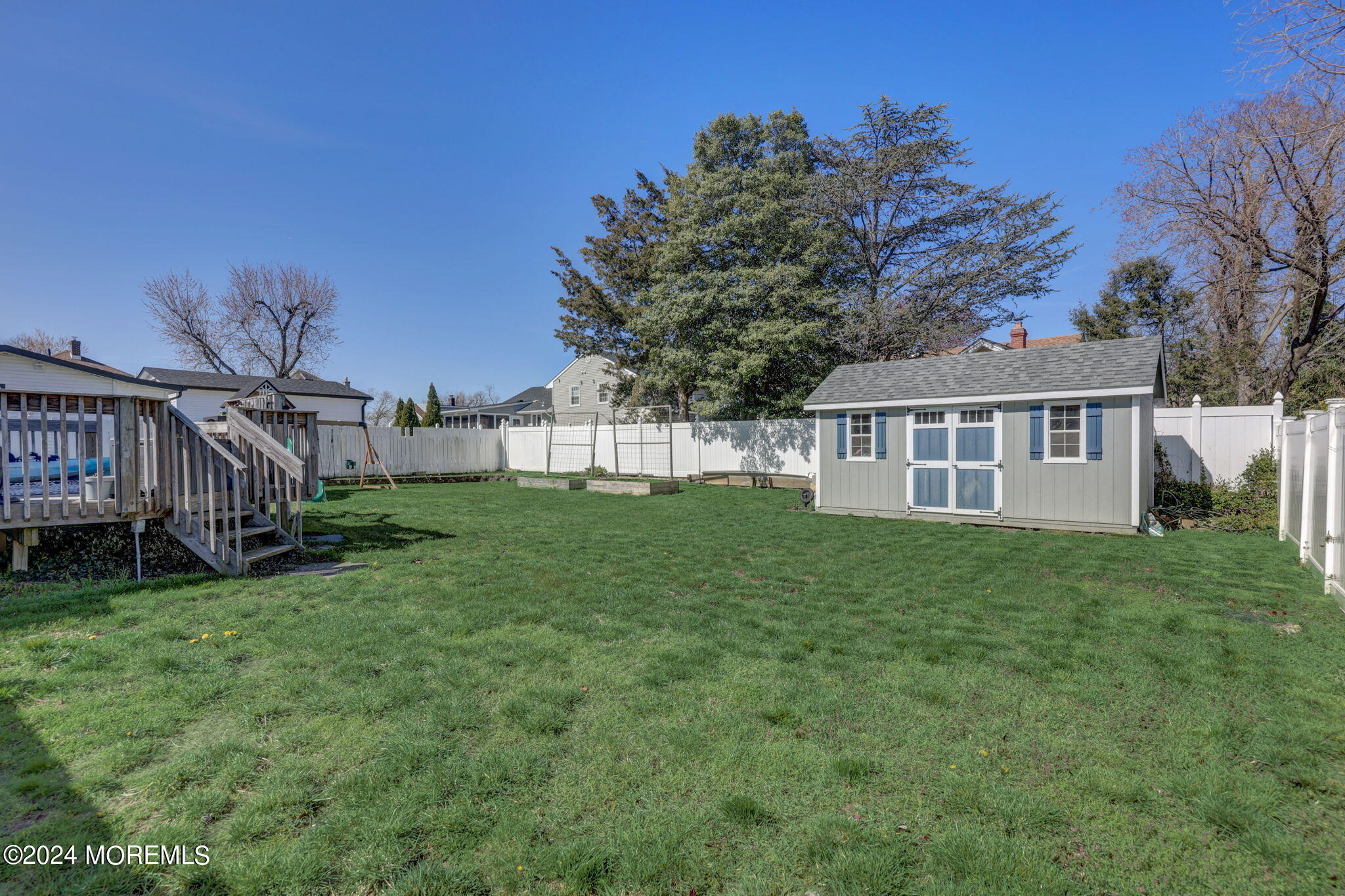 154 Ridge Avenue Belford, NJ 07718 - Photo 28 of 28 a view of a house with backyard and garden