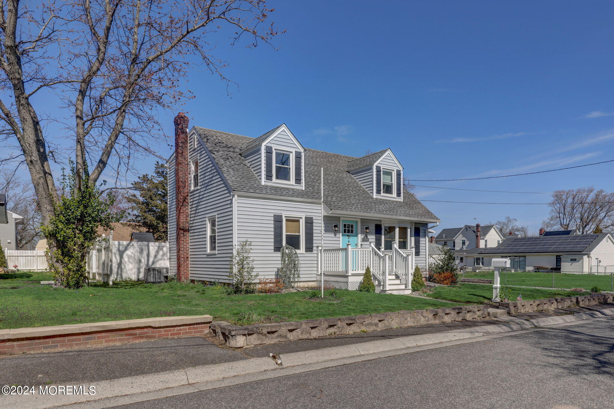 154 Ridge Avenue Belford, NJ 07718 - Photo 3 of 28 a front view of a house with a garden
