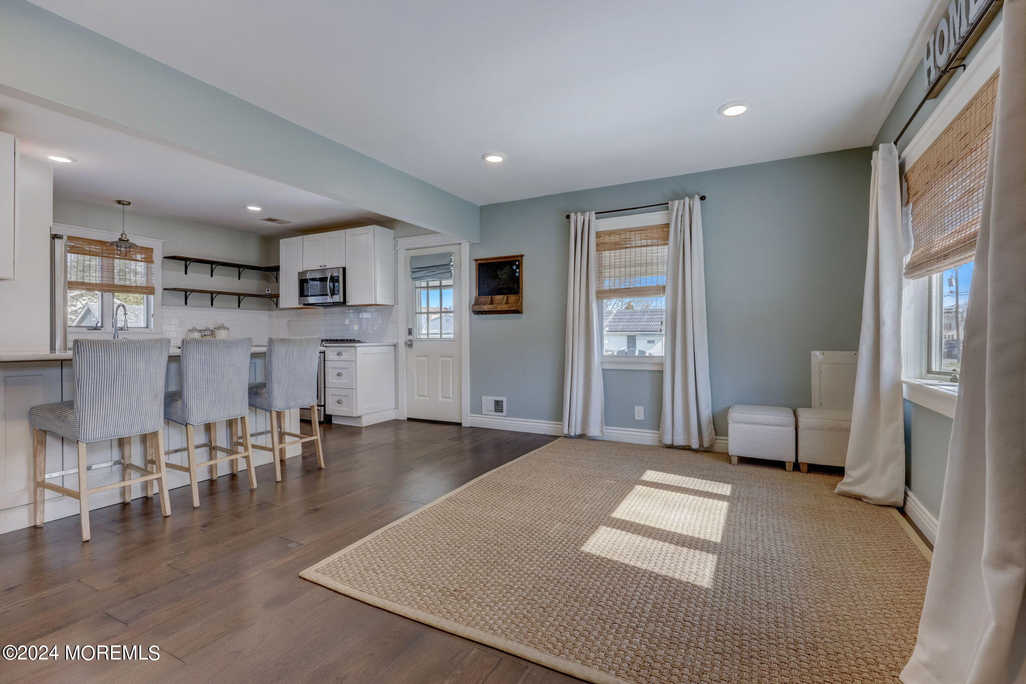 154 Ridge Avenue Belford, NJ 07718 - Photo 8 of 28 a living room with furniture and a table