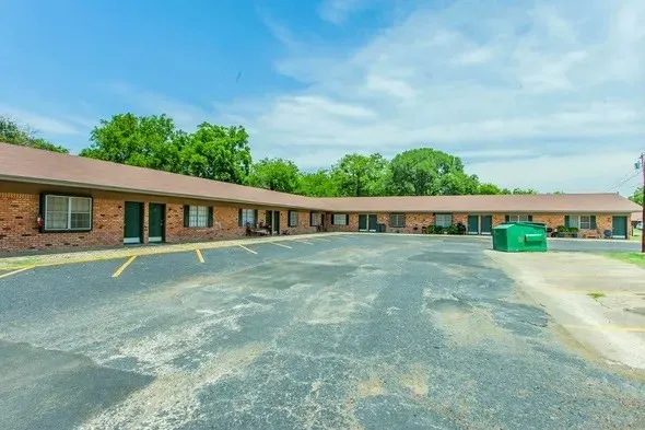 a view of entryway with brick walls and windows