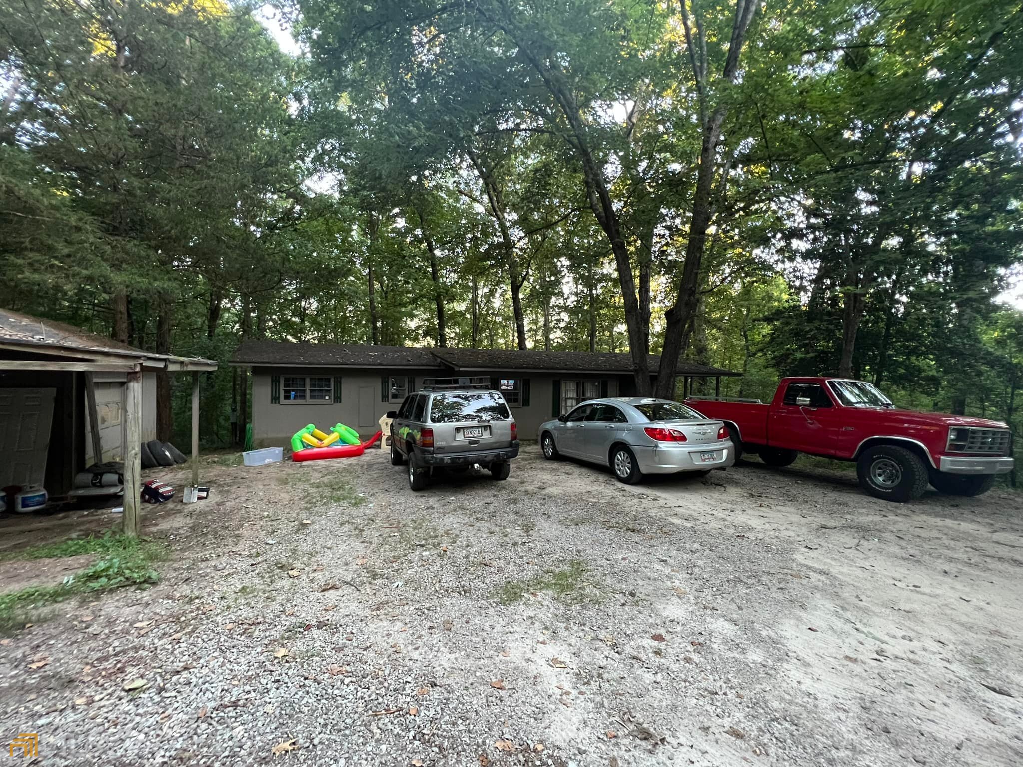 a view of cars parked in a dirt area