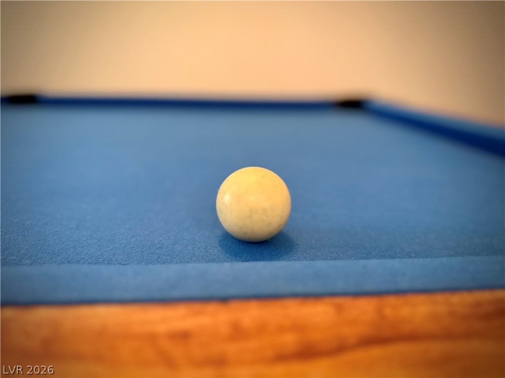 1220 East Gamebird Road Pahrump, NV 89048 - Photo 11 of 49 Ready for recreation, this well-maintained billiards table promises hours of entertainment.
