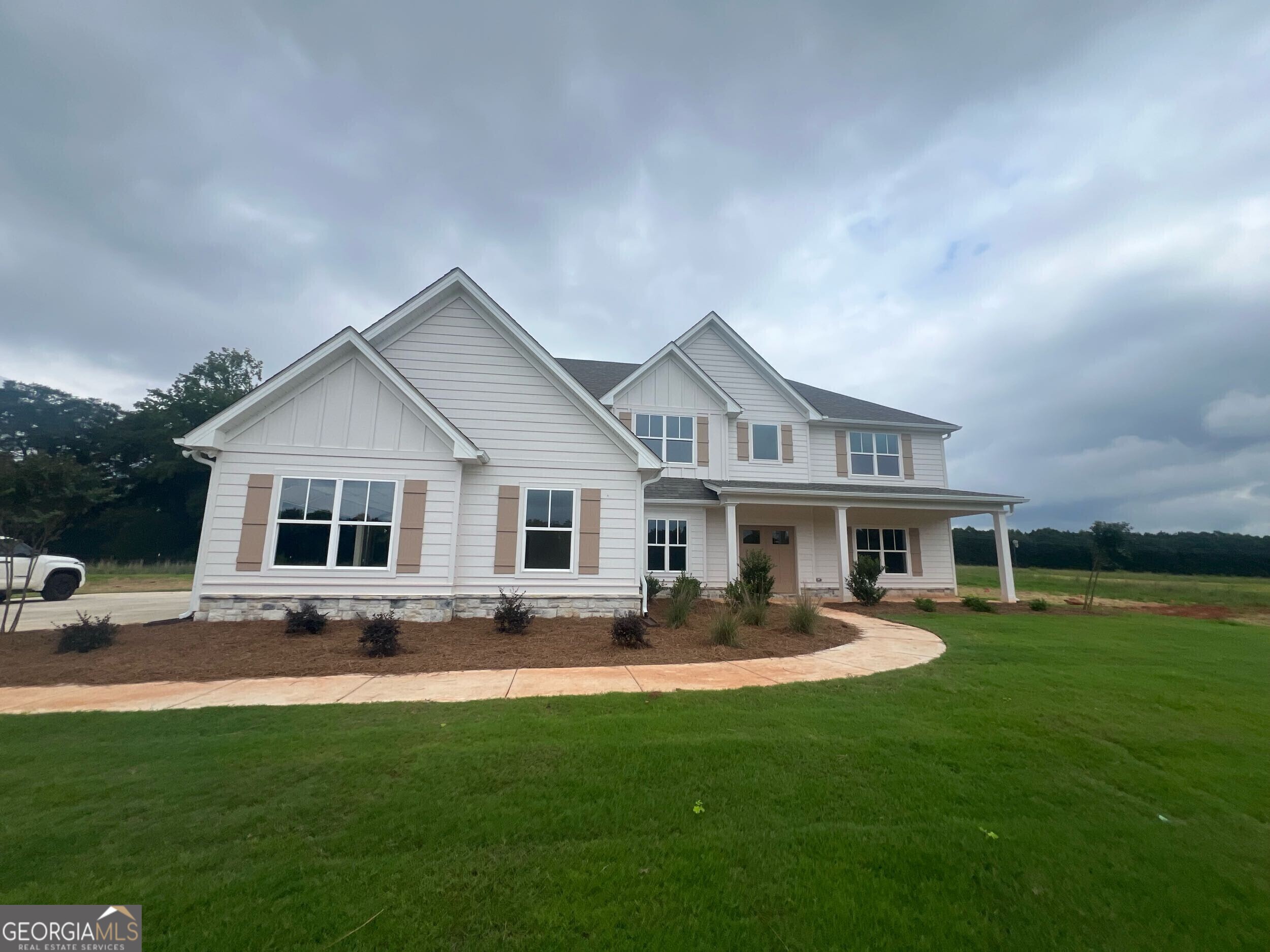1130 Patterson Road Griffin, GA 30223 - Photo 1 of 1 a front view of house with yard and green space